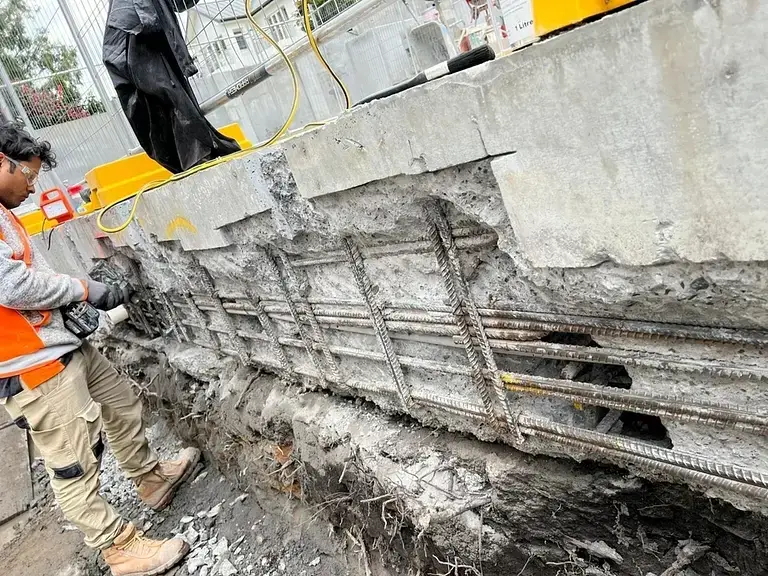 Concrete repair at Coolong Rd, Vaucluse — exposed corroded reinforcement in the pool edge beam prepared for treatment