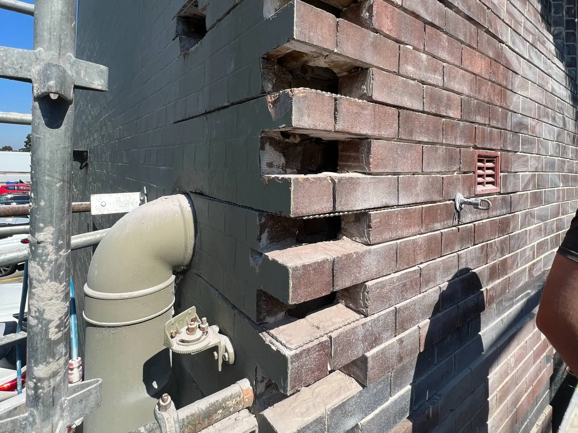 Brick restoration at Maddox St, Alexandria — cut-out brickwork prepared for rebuilding around new services