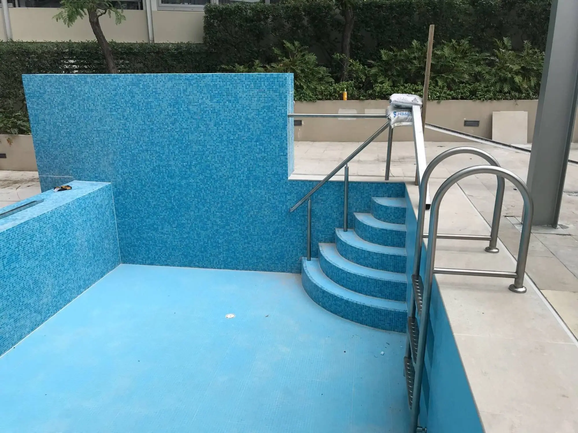 Pool remediation at Shelley St, Sydney CBD — original tiled pool and stairs before demolition and re-waterproofing