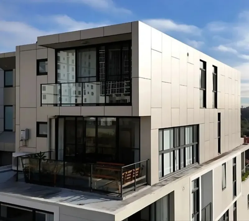 Sydney apartment facade clad in flat metal panels, the type of ACP cladding replaced with compliant non-combustible panels