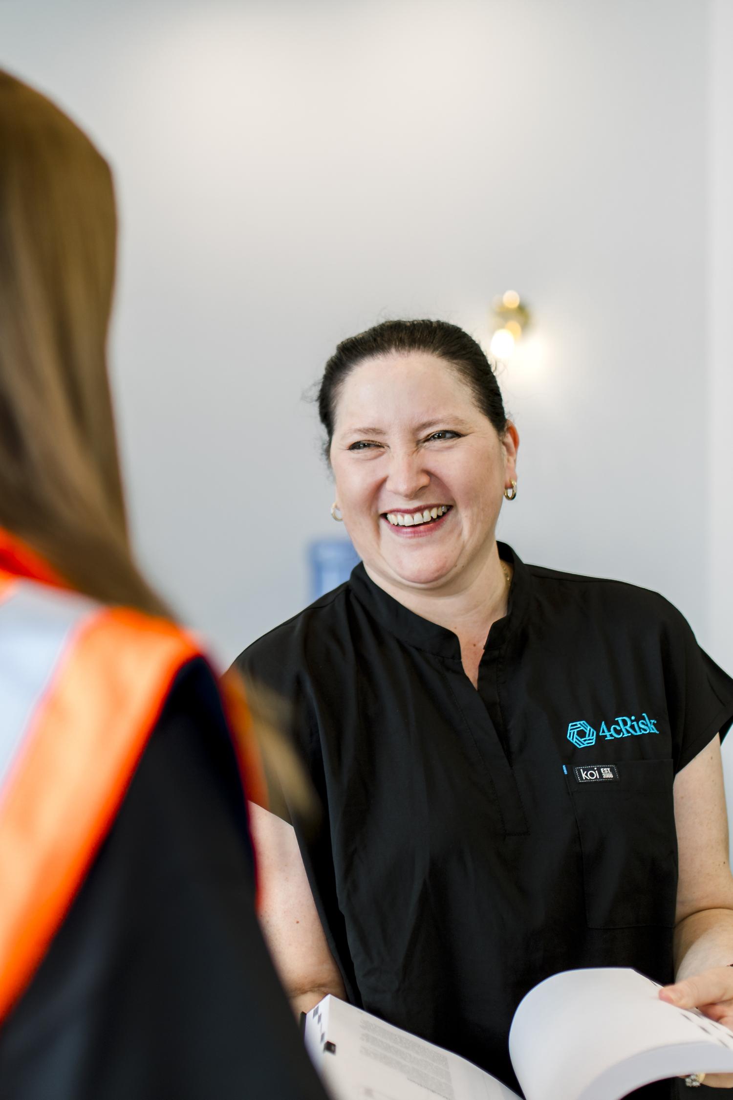 A man in protective gear on a worksite.