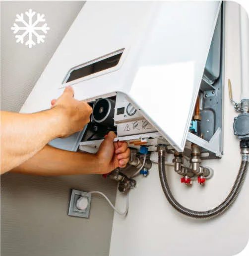 A person is fixing a water heater.