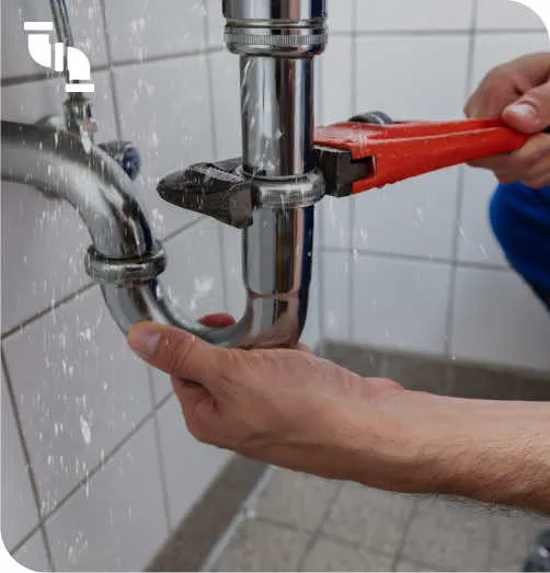 A person is fixing a faucet in a bathroom.
