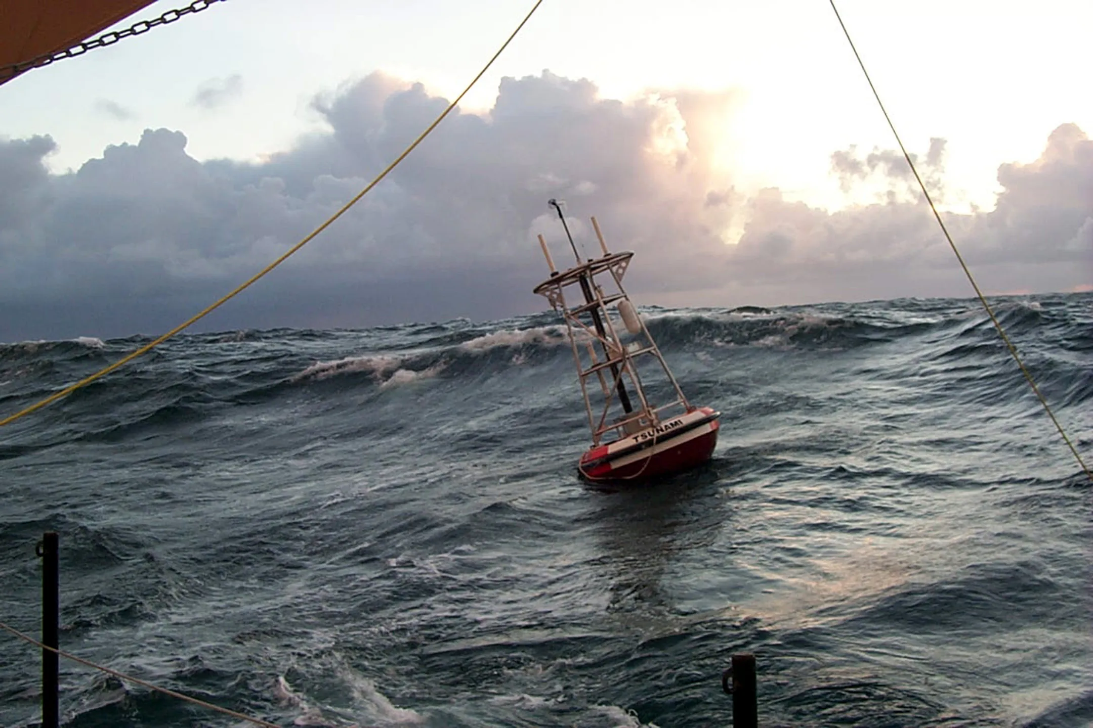 Ocean research buoy fitted with a 401 MHz antenna in heavy seas
