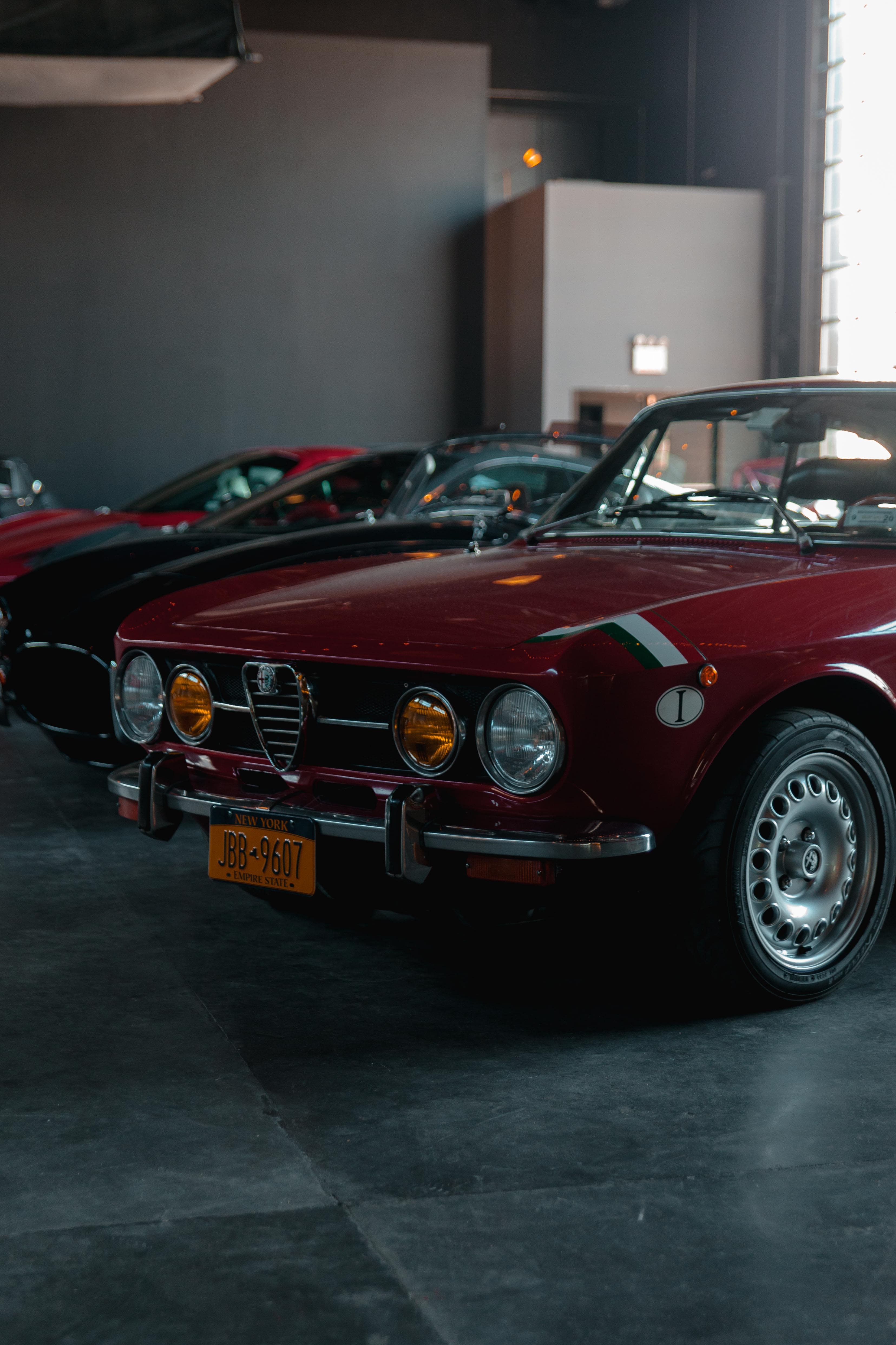 Red classic car parked in a garage
