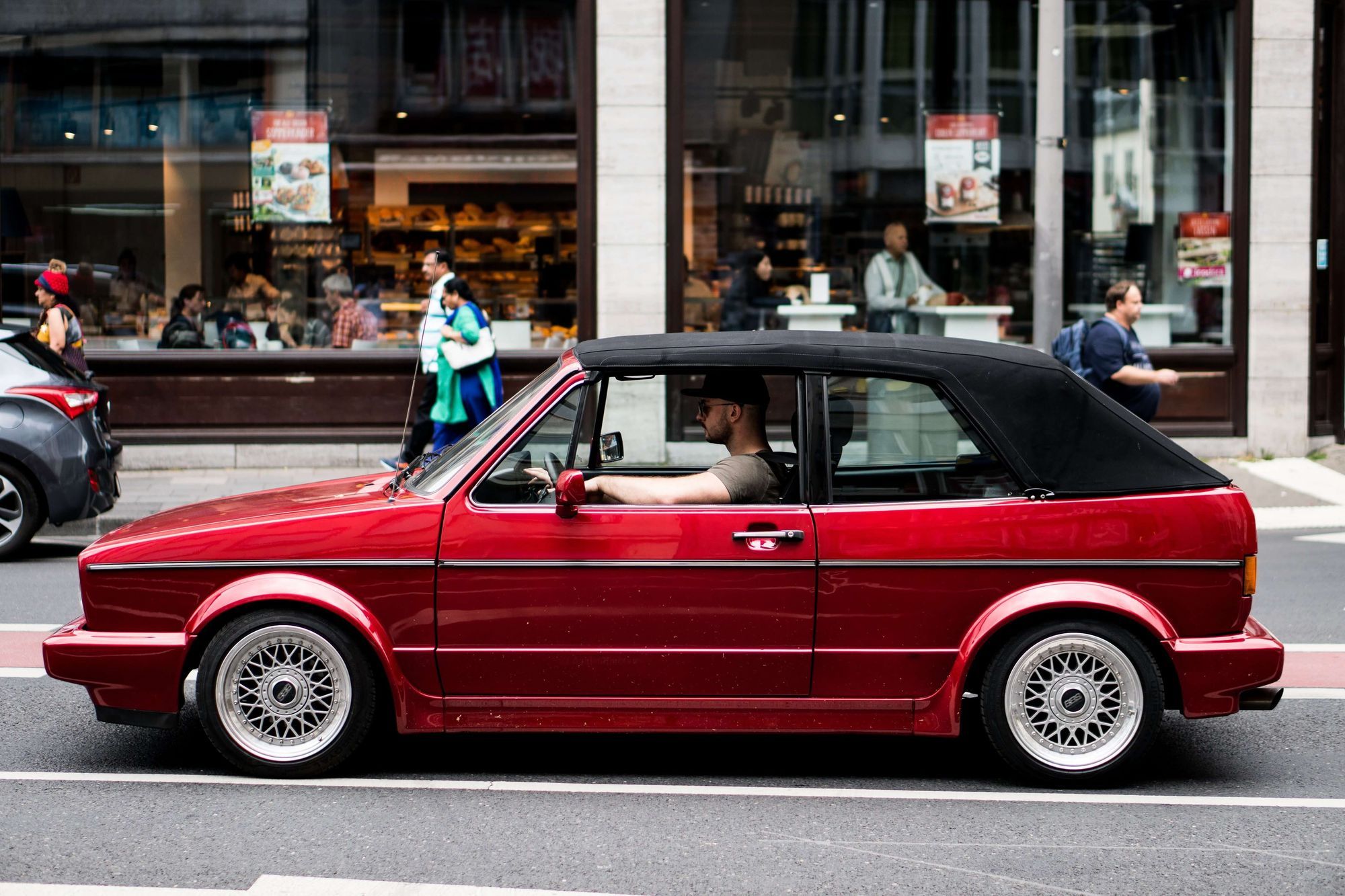 Red convertible VW with black top