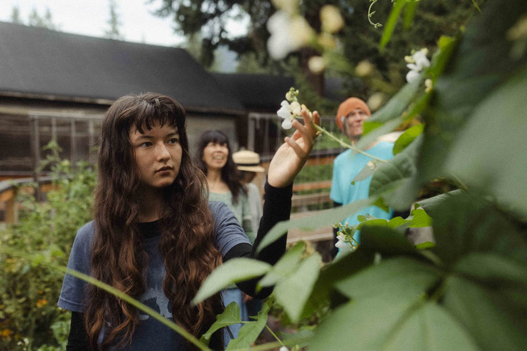 Visitors exploring the garden plants
