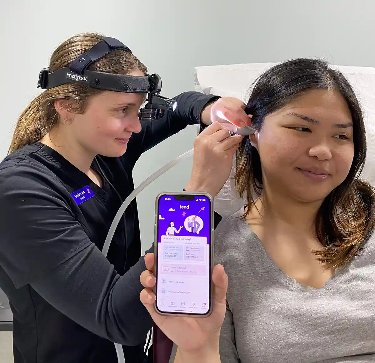 Nurse Rebecca performing ear suction on a patient
