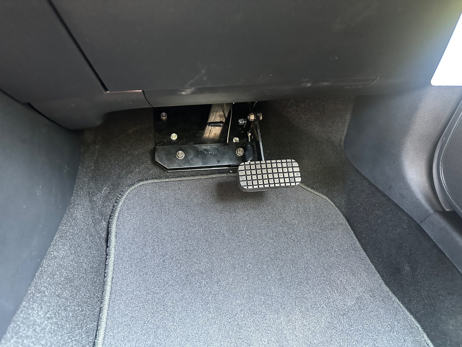 DuoBrake Cable Brake installed in the passenger footwell of a Mazda 3