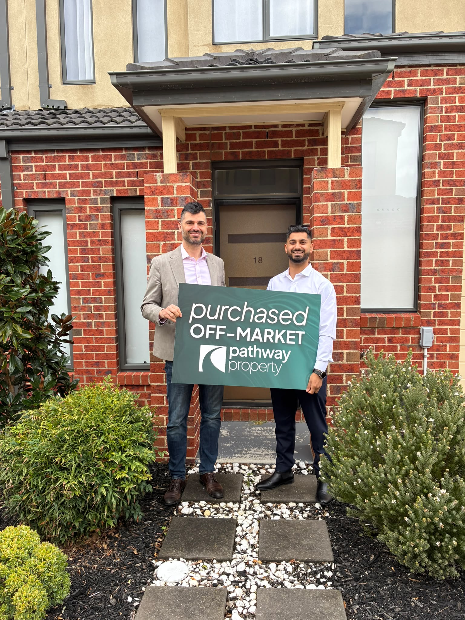 A Pathway Property client outside the home they purchased