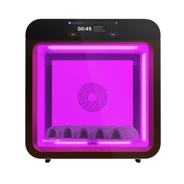 Square 3D printer with purple light printing a curved, detailed object inside the chamber.