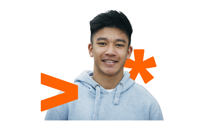 A young man smiling.