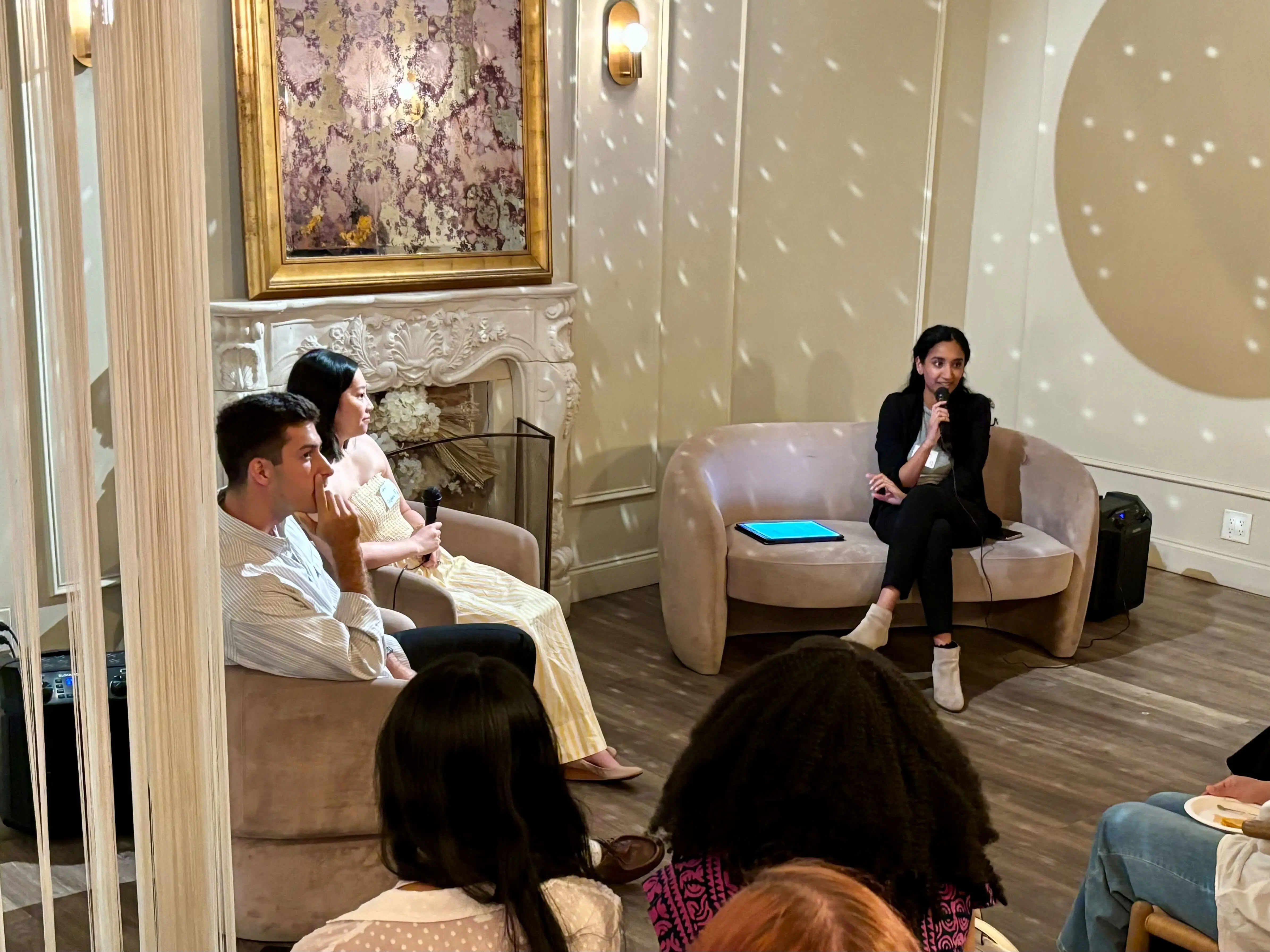 Raspberry AI team members in a room hung with framed artwork