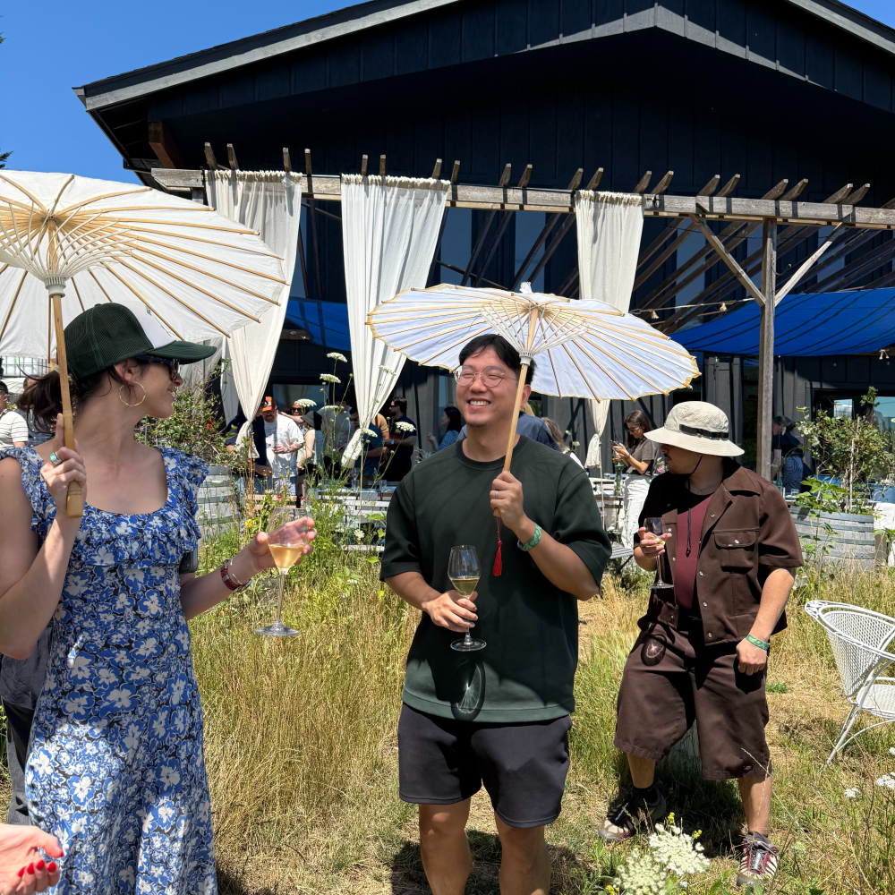 Raspberry AI team gathered outdoors under a blue canopy
