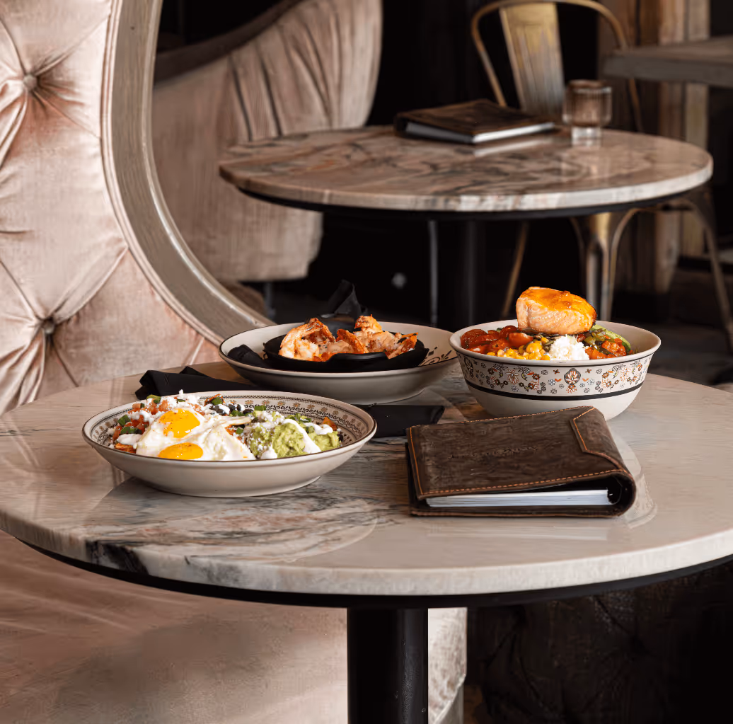 Three of our dishes, focus on our NY Steak & Paella Baja Style. Latin Inspired food in Salt Lake City.