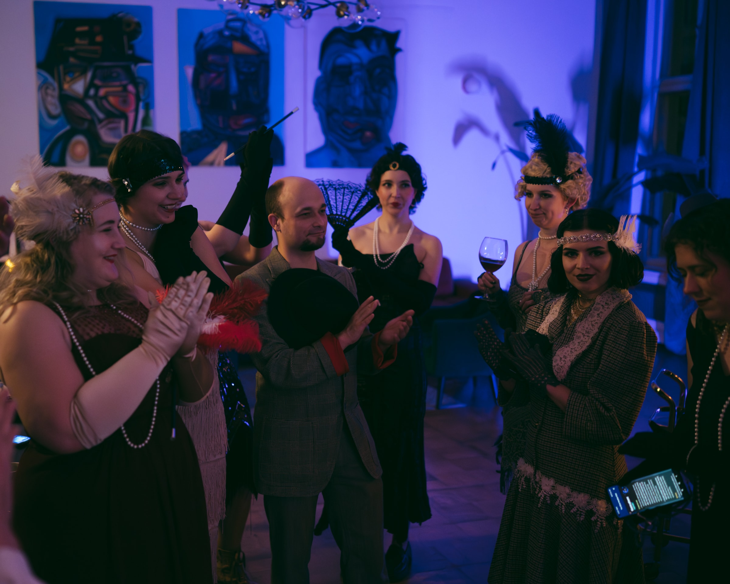 Murder mystery party guests celebrating