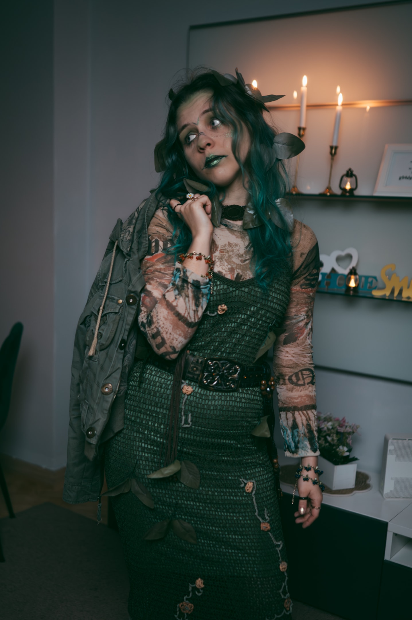 costume party guest in leafy green dress with homemade accessories