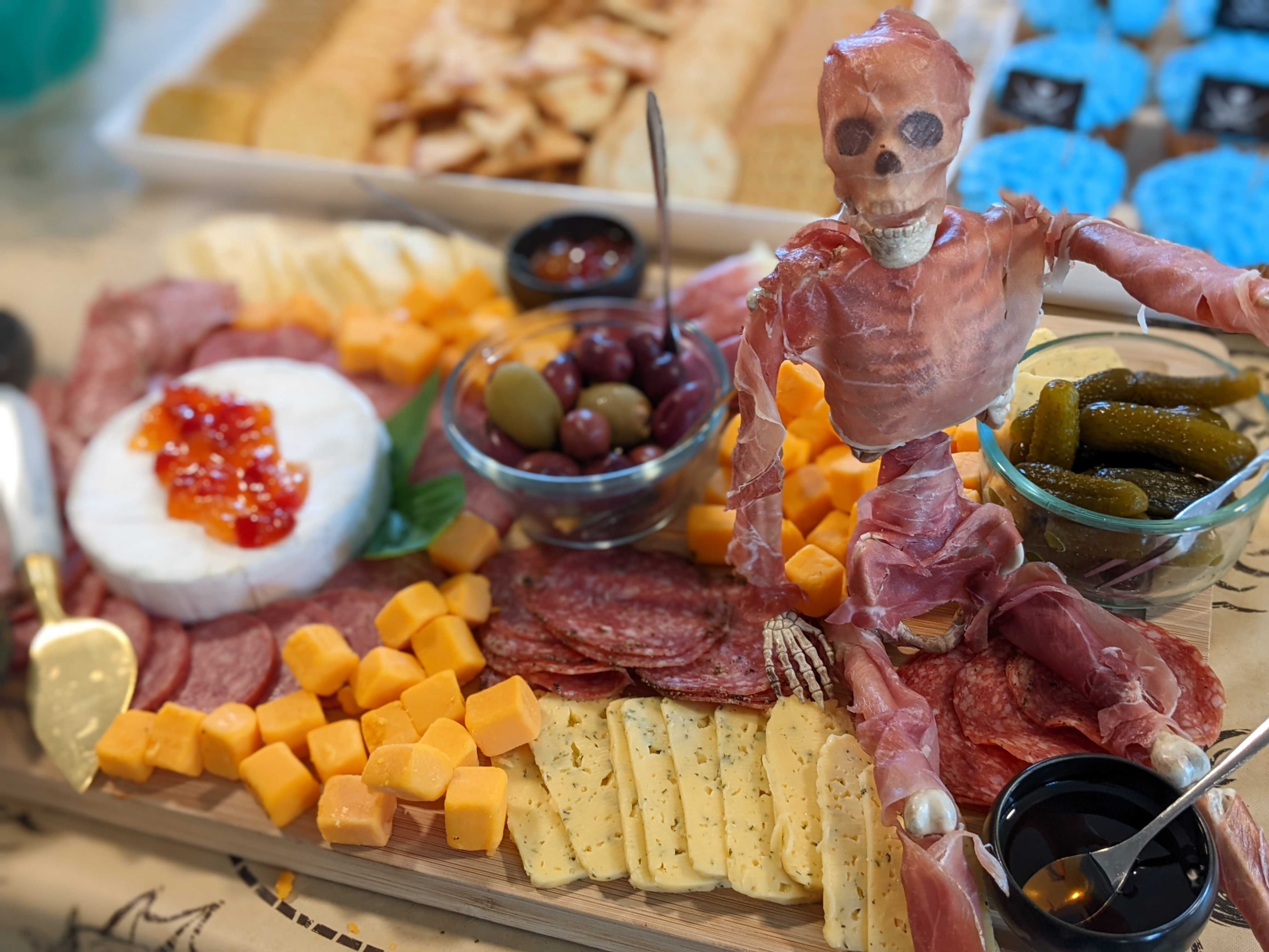 Spooky skeleton charcuterie board for fall or Halloween