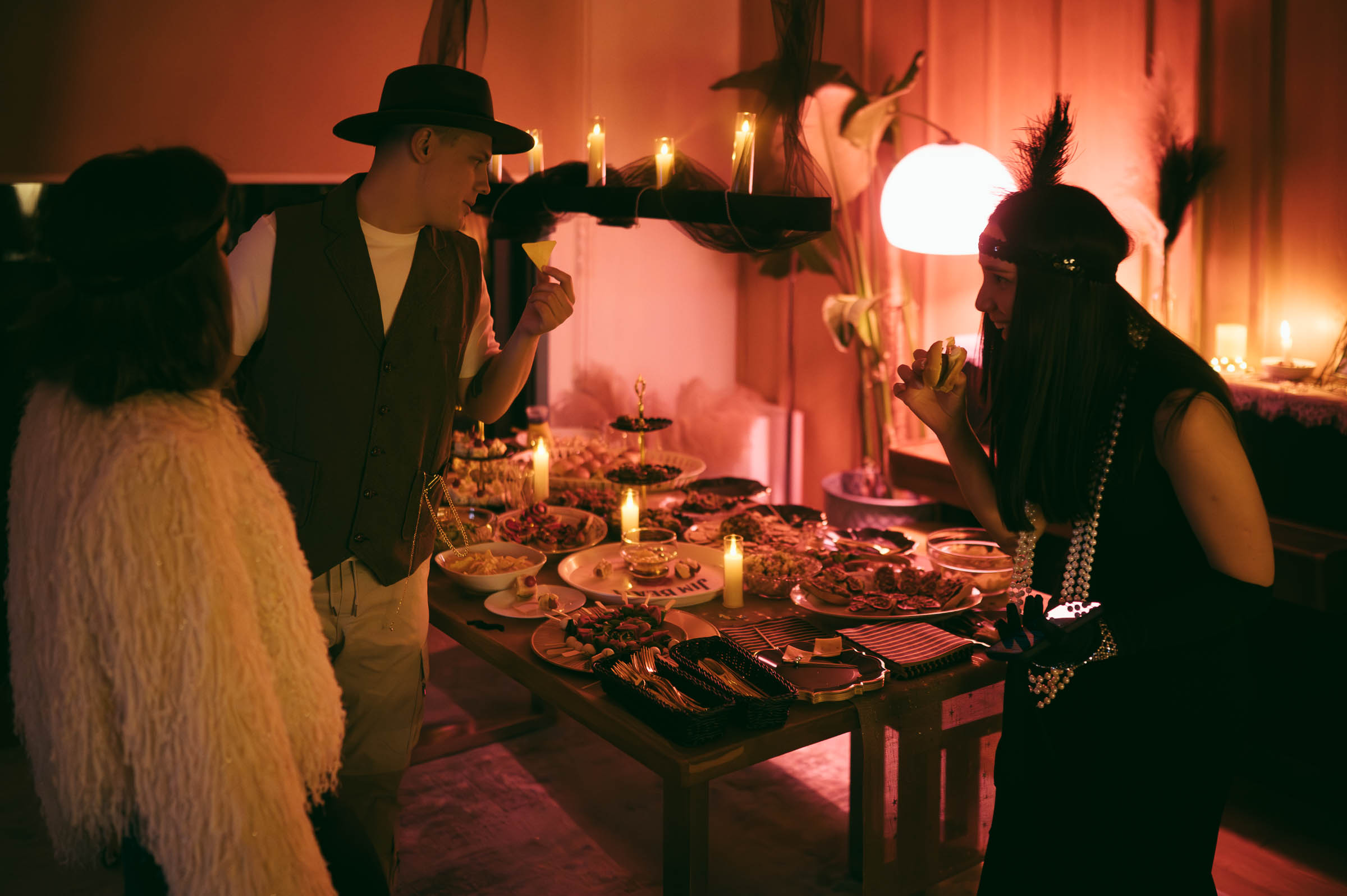 Costumed guests enjoying snacks during a role playing game