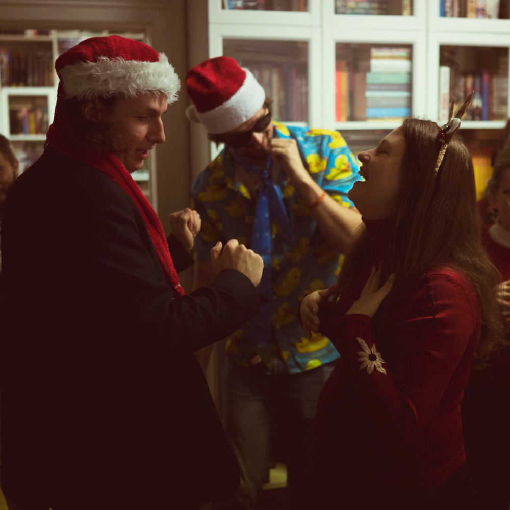 Holiday theme party attendees dancing