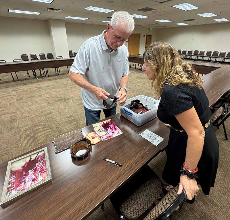 A man shows off his rodeo memorabilia