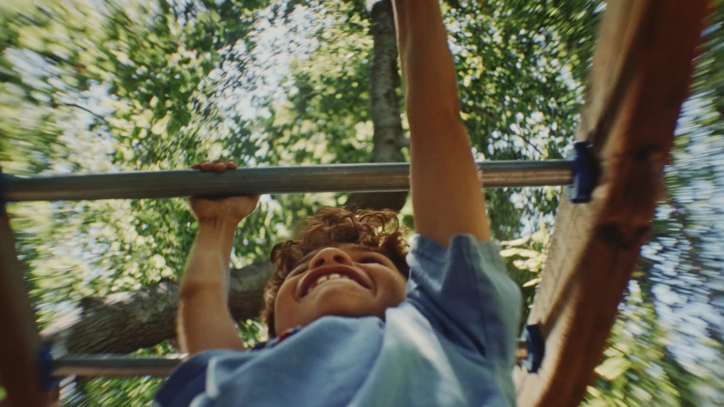 Two kids playing NEX Playground in their living room