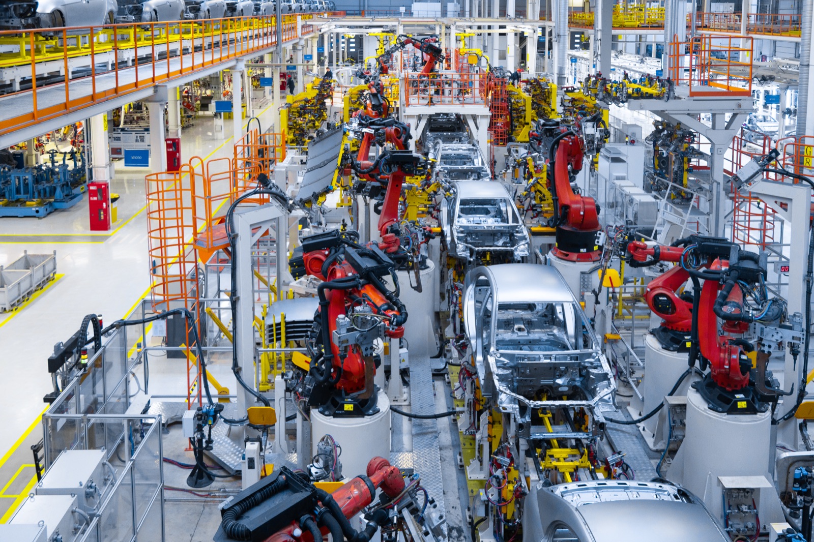 Automotive production line welding a car body