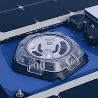 Close-up of a solar panel surface with reflective, grid-like pattern under light.