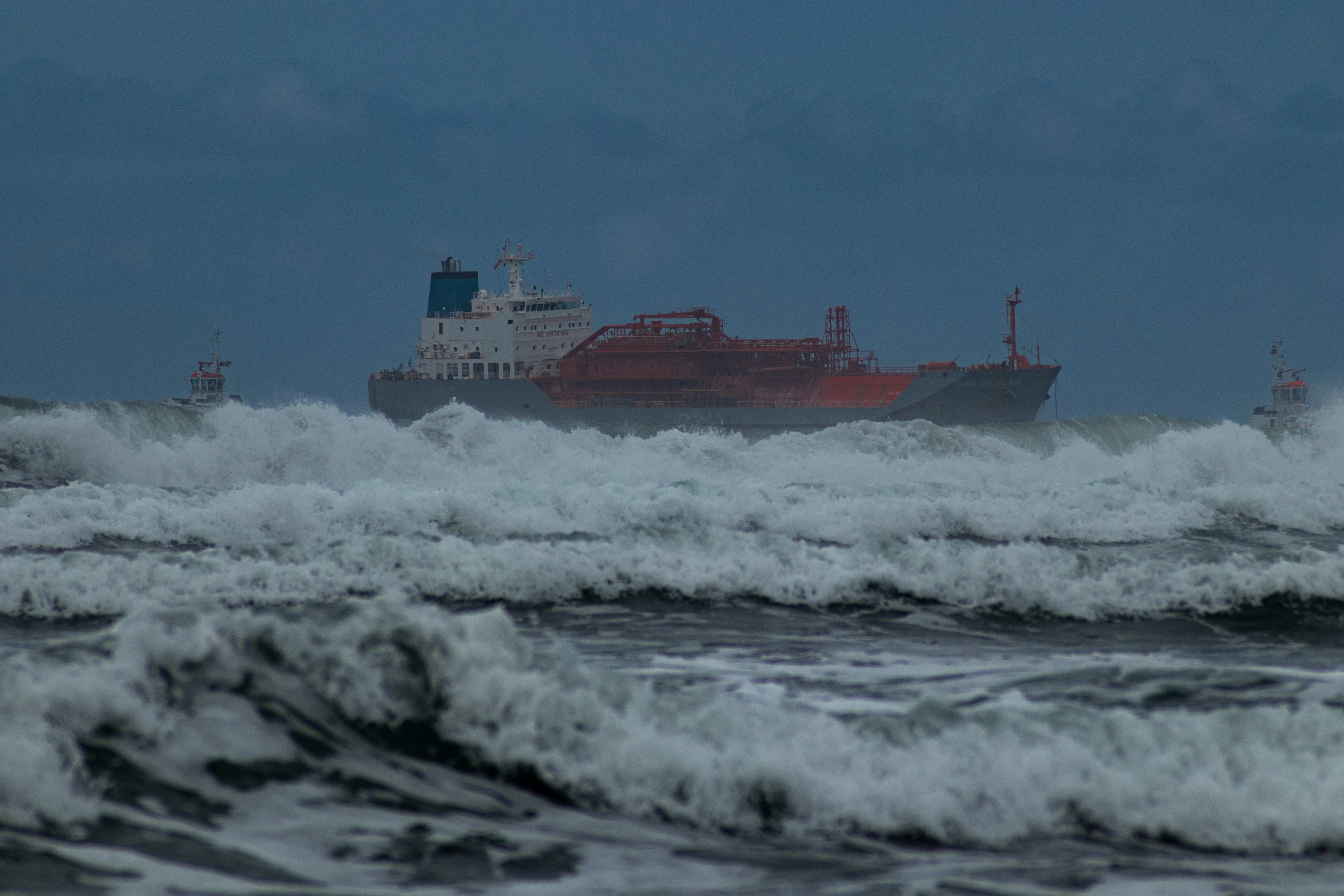 cargo ship navigating rough seas without vessel monitoring