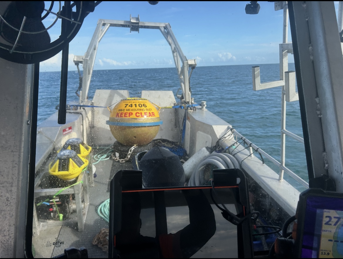 Two Spotters (left) alongside a Datawell buoy aboard a DETSI vessel, illustrating the size difference between the two platforms.