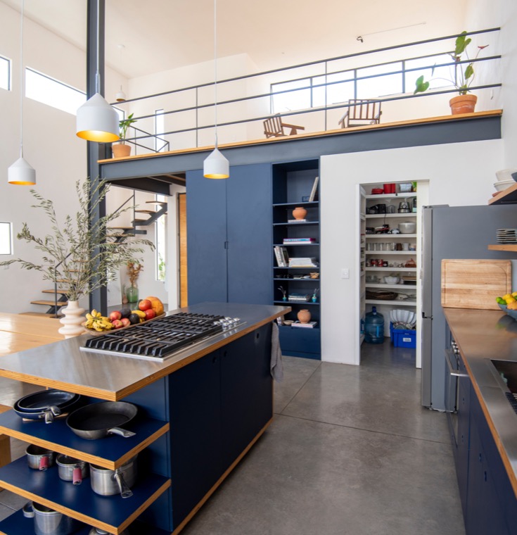 A light-filled Kindred member home with a mezzanine and open kitchen