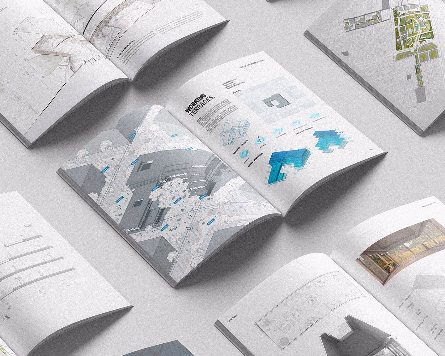 Open architecture portfolios displaying building designs, site plans, and working terrace diagrams.