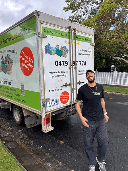 Melbourne Rubbish Truck with staff standing behind