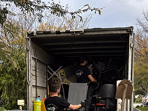 Old Sofa in the backyard with 2 dogs in the front