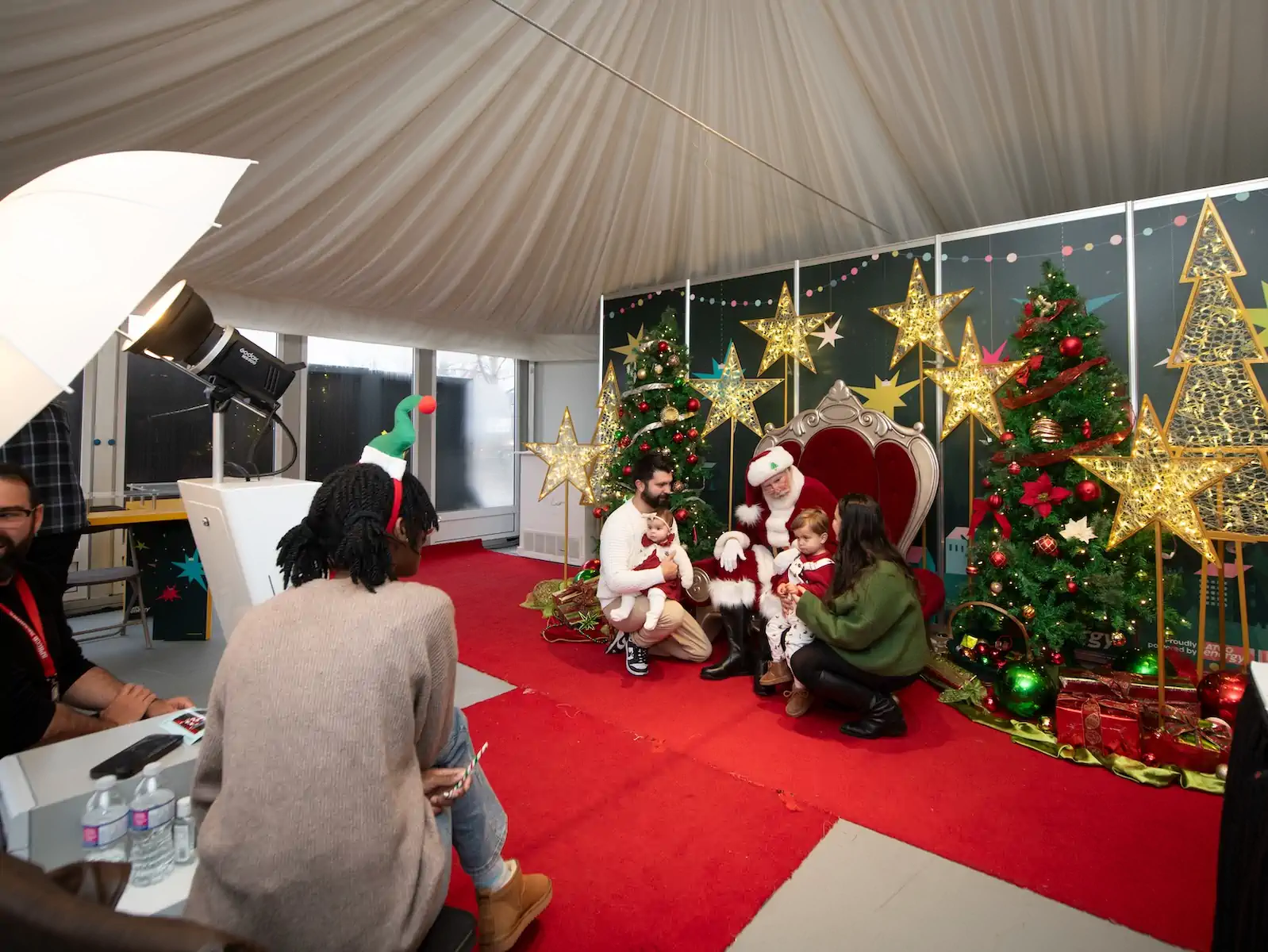Parents and children talk to Santa at ATCO Energy's International Christmas Market at Spruce Meadows.