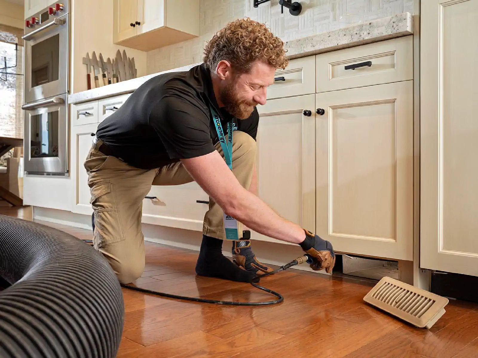 An ATCO Energy technician inspecting an HVAC system