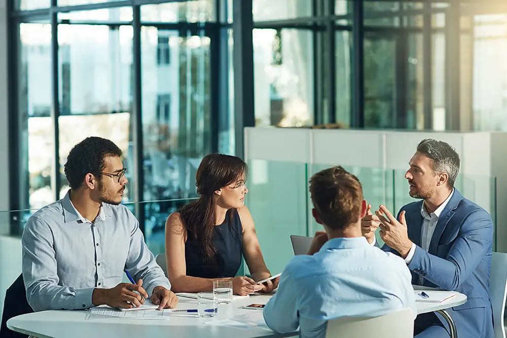 People sitting at a table and having discussion