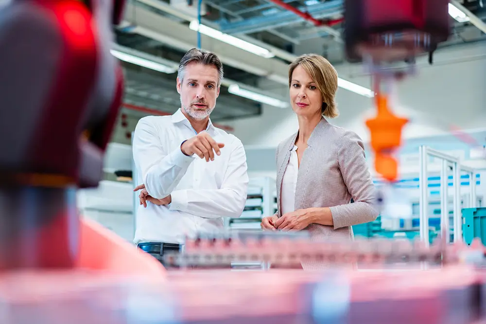 Two people standing in a lab