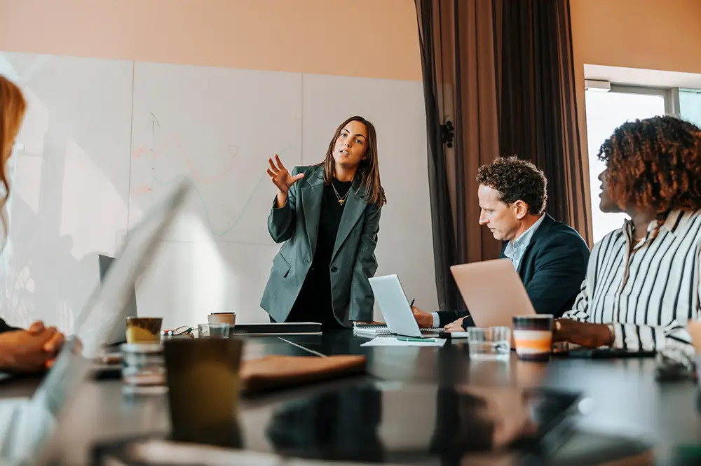 A woman presenting in a meeting