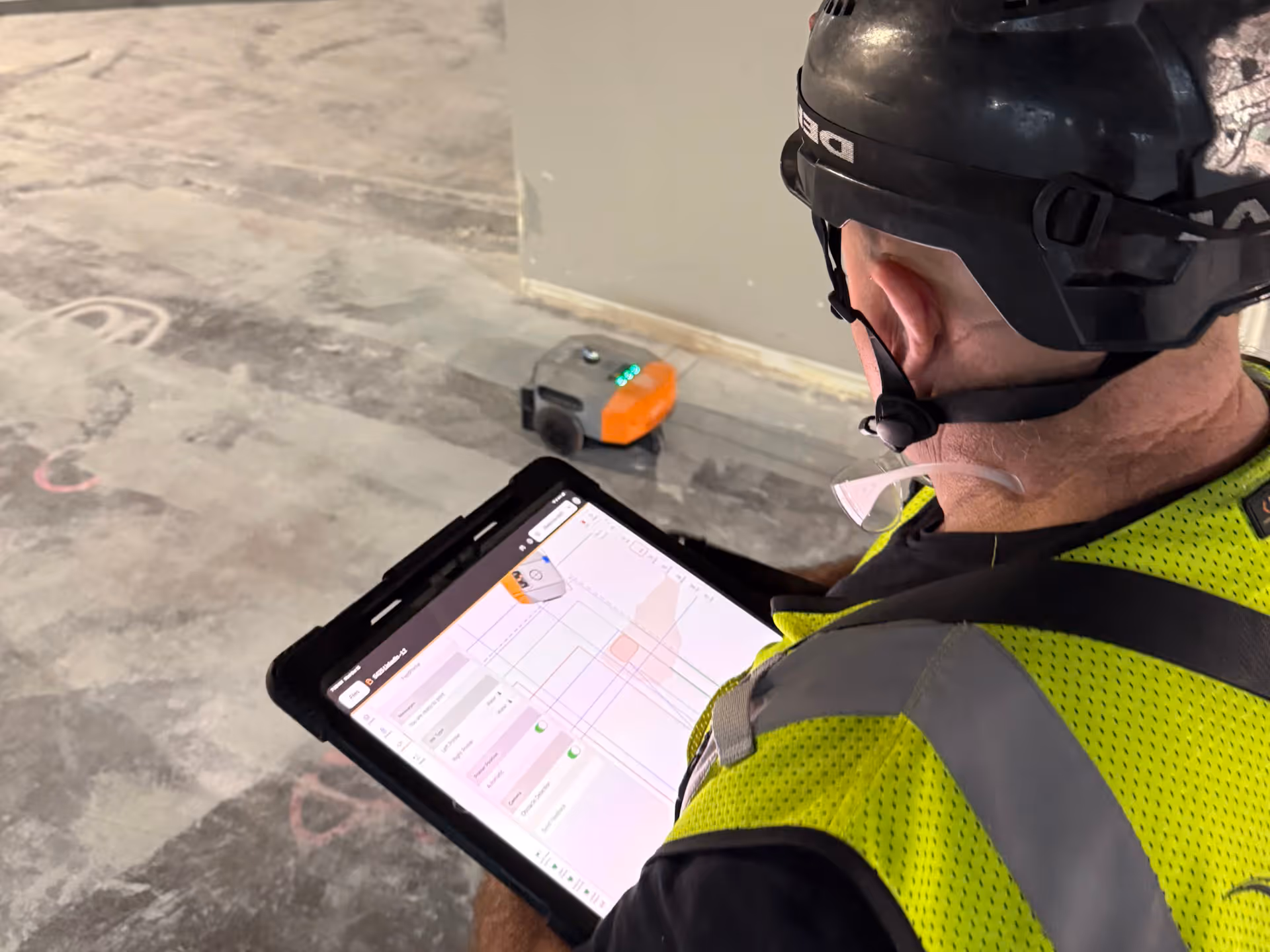 Daley's Drywall layout crew running a Dusty FieldPrinter on a multifamily floor