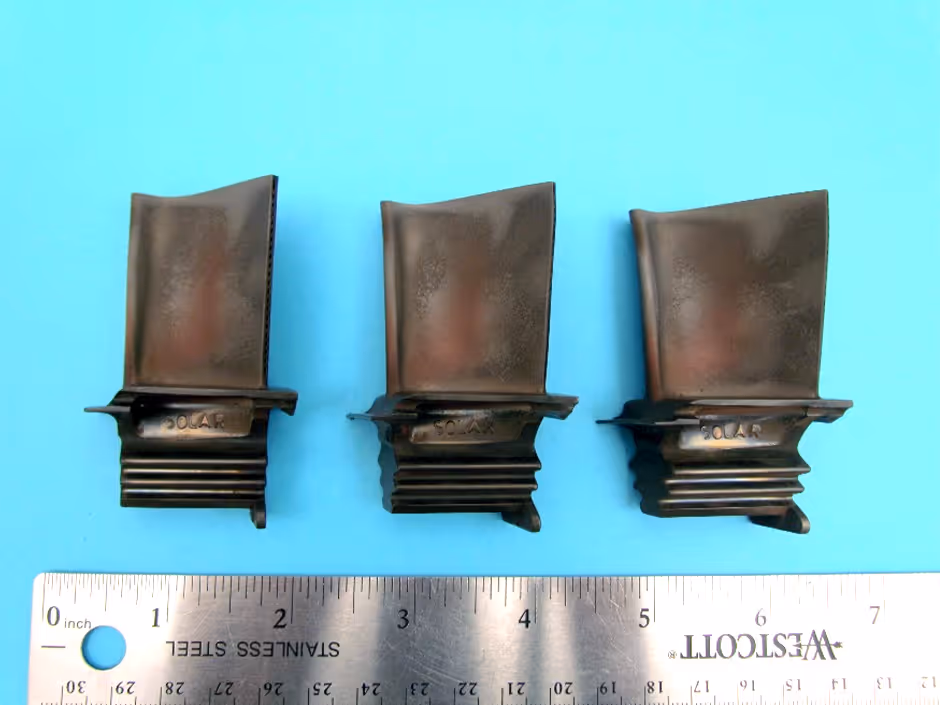 Solar T60 stage 1 turbine blades as received for visual inspection with ruler for scale