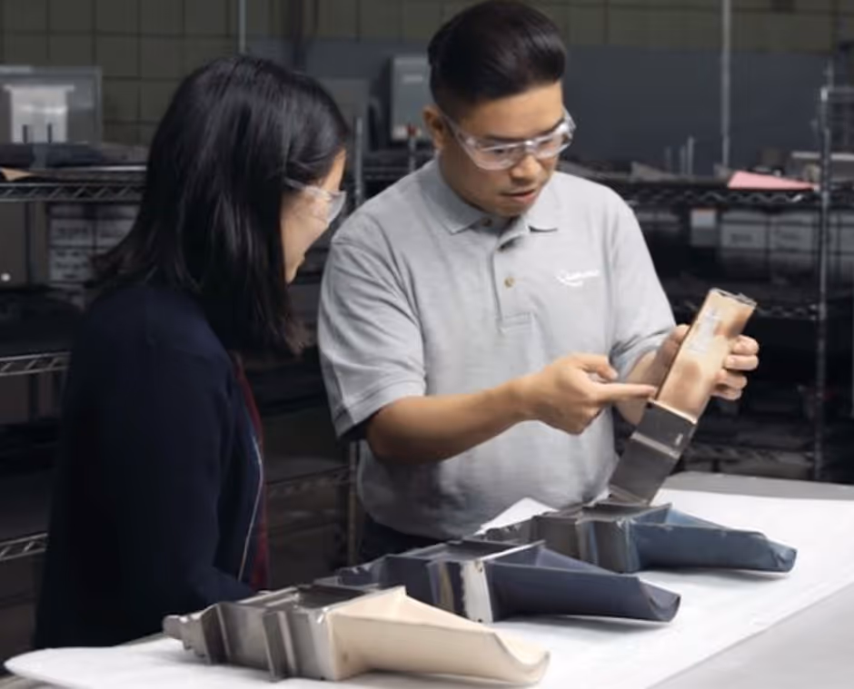 Liburdi technicians inspecting gas turbine components for coating wear and discoloration