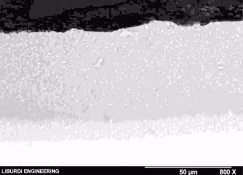 Nickel aluminide coating on IN738 alloy formed using the LSR diffusion process.