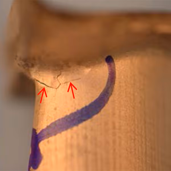 Cracking along stray grain boundary in single crystal gas turbine blade airfoil