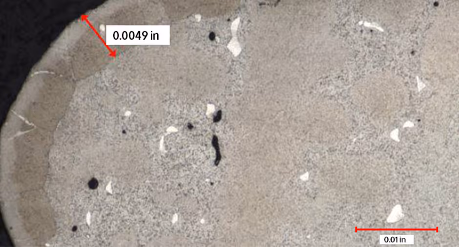 Recrystallized grain layer on single crystal turbine blade root surface microstructure