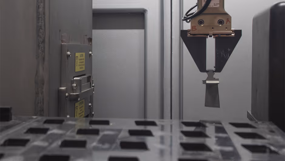 CT scanner loading gas turbine blade for internal inspection