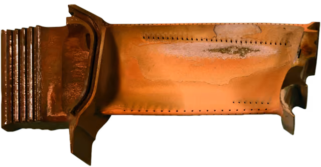 Gas turbine blade showing oxidation damage and coating loss.