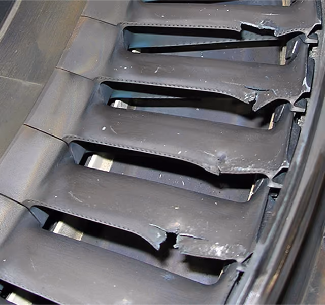 Gas turbine blades damaged by foreign object impact.