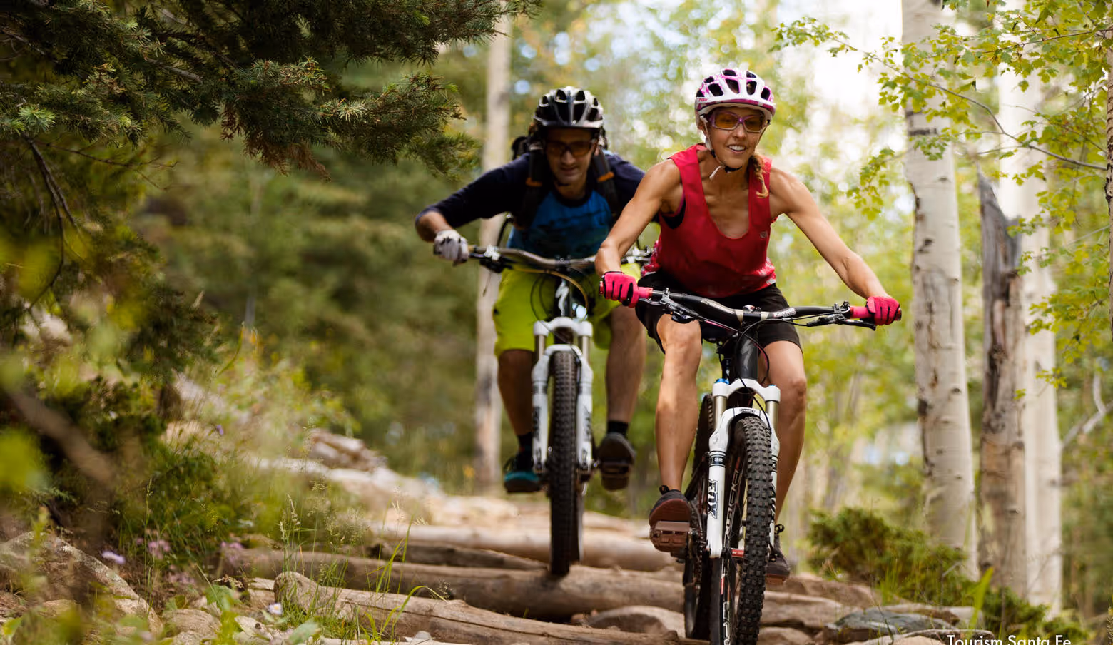 People mountain biking
