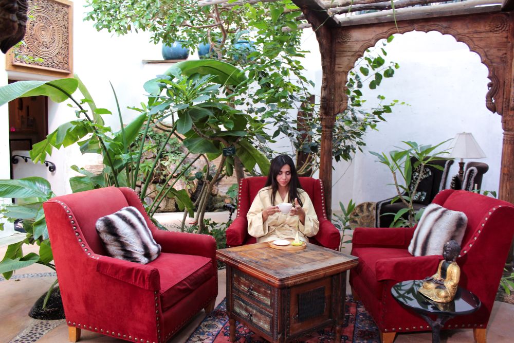 Woman in The Living Spa drinking tea
